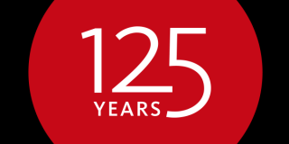 A red circle on a black background with white text that reads: 125 Years